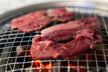 grilling beef on the charcoal