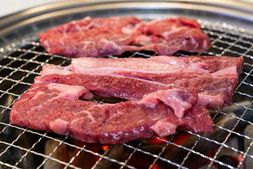 grilling beef on the charcoal