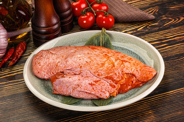 Raw marinated duck breast for cooking