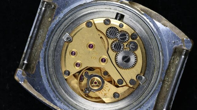 Clockwork mechanism rotates in a circle, looped video