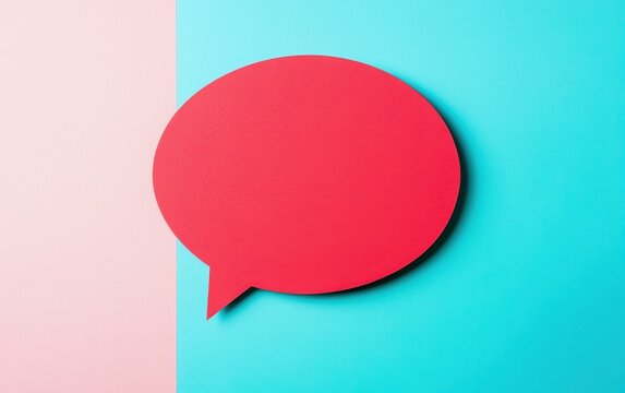 A vibrant red speech bubble on a contrasting blue and pink background, ideal for communication and expression themes.