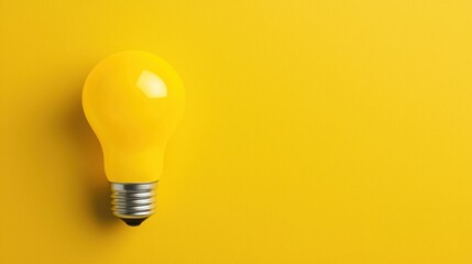 Bright yellow light bulb on a vibrant yellow background, symbolizing creativity and innovation. Ideal for modern design projects.