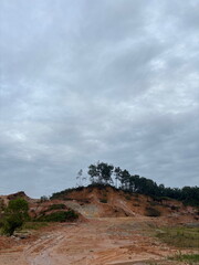 Morning View of a Deforested Hilltop: Clay Mining and its Environmental Consequences