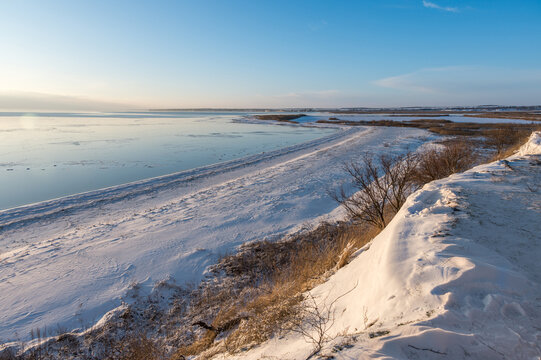 A spectacular winter landscape in the Russian countryside with waterfront. Surroundings of Taganrog.
