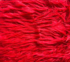 A close-up of a red furry fabric. Good for any project.