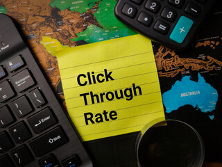 Keyboard,magnifying glass and calculator with text Click Through Rate on a world map