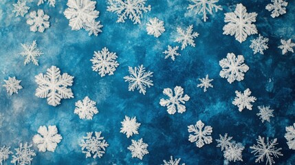 Icy snowflakes in sharp detail against a frosty blue background