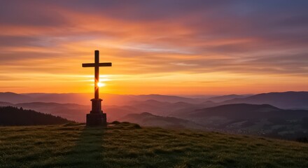 A solitary cross standing on a grassy hilltop overlooking a valley at sunset