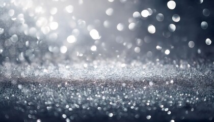 Defocused silver glitter texture sparkling with abstract bokeh background creating a festive and glamorous atmosphere
