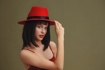 Woman, red hat, red lipstick a woman in a vibrant red hat, adorned with matching red lipstick,...