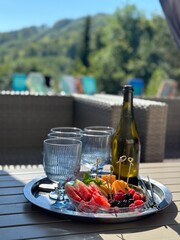 wine with fruit by the pool