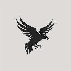 Obraz premium A bold and dynamic black silhouette of a raven mid-flight, showcasing its sharp talons and detailed wings against a light gray background, symbolizing mystery and freedom.