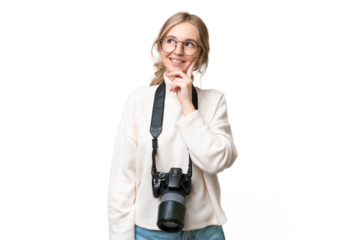 Young photographer English woman over isolated background thinking an idea while looking up