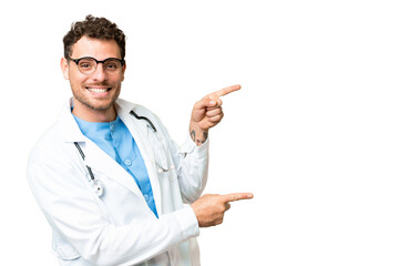 Brazilian doctor man over isolated chroma key background pointing finger to the side and presenting...