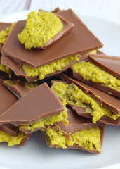 close-up of Trendy Dubai style chocolate pieces on the white plate