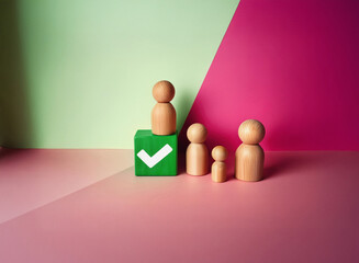 Grainy image of wooden figurines, a family, standing near a green block with a checkmark.  The texture is subtly visible on the figures.  Pink and green background.