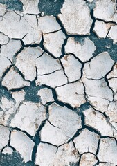 Fototapeta premium A high-resolution texture of an old, cracked white wall with subtle gray tones and a rough appearance. The background is a dark blue to contrast the grunge surface.