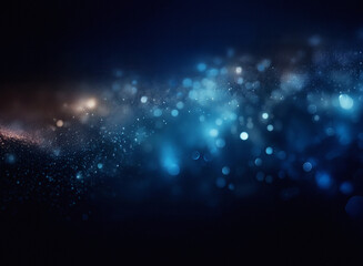 A grainy, textured abstract image featuring a swirling nebula of blue and orange light.  The bokeh effect creates a sense of depth and movement.