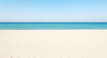 Fototapeta premium A scenic beach view with a clear sky and a large blank space in the center for text