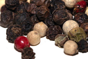 Close up of mixed pepercorn on white background