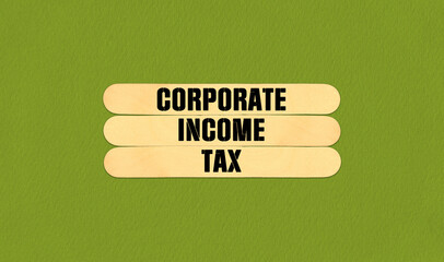 CIT Corporate Income Tax  Symbol. Concept word CIT Corporate Income Tax  on beautiful wooden stick. Beautiful Green Chart Paper Background. Business and CIT Corporate Income Tax  concept. Copy space