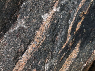 Stone close-up, textured picture, background, colored stone after the rain