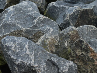 Stone close-up, textured picture, background, colored stone after the rain