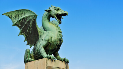 Fototapeta premium Dragon Statue on the Dragon Bridge. The Dragon is the Symbol of Ljubljana. Ljubljana, Slovenia