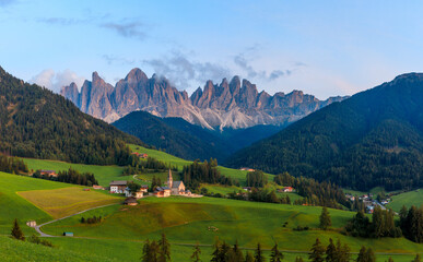 View above the Villnößtal Val di Funes with view on the Geislerspitzen Odlegruppa during sunrise...