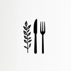 Simple black cutlery and leaves on white background for menu or restaurant use
