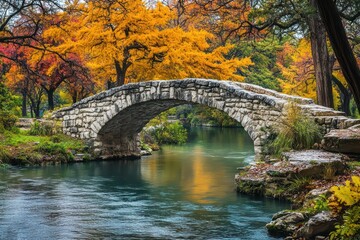 A rustic stone bridge spanning a tranquil autumn river surrounded by colorful trees