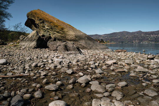 View of the erratic rock of Quassa bay, lake Maggiore in the north Italy