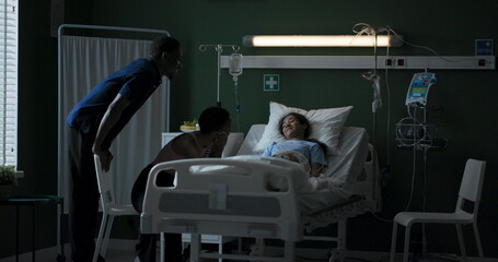 Mom and dad enter the ward where their daughter is being treated.