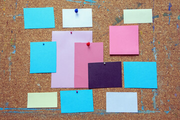 Different notes on old cork board. Copy space