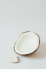 Fresh coconut on white background. Healthy raw food, dessert without sugar and flour. The concept of zero waste, pesticide-free and eco-friendly