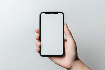 A person is currently holding a cell phone that has a white screen