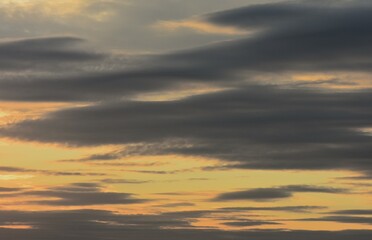 Cloudscape, Colored Clouds at Sunset near the Ocean on a Cloudy Day