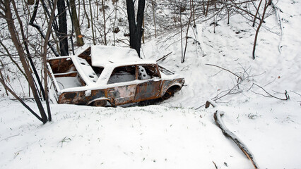 Accident on a winter snowy track. car skidding and falling into a ditch due to ice. Safety and poor...