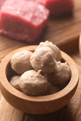 beef meatballs in a wooden bowl. bakso sapi.