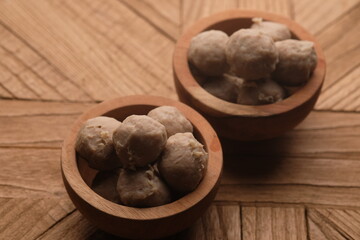beef meatballs in a wooden bowl. bakso sapi.