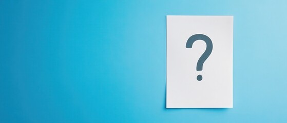 A question mark positioned on a piece of paper with a blue background