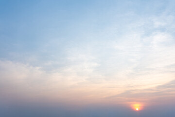 Serene Sunset Sky Soft Pastel Colors Fluffy Clouds and Golden Sun