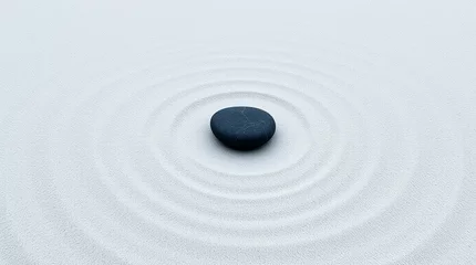 Black stones in the sand of a Japanese Zen garden