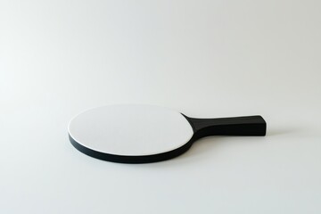 Ping pong paddle captured with high detail, showcasing sharp edges and realistic lighting in a minimalist setting