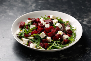 Fresh Beetroot feta salad with wild rocket and lemon dressing. Healthy food.