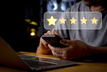 A person rating on a smart phone, working online in an office setting