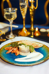 Herring appetizer, cream sauce, carrot chips, kale and toast