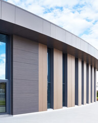 Fototapeta premium Modern architectural design featuring wood and metal elements in a sleek building