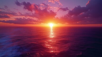 Obraz premium A stunning sunset over the ocean with vibrant colors. Great for themes of tranquility, nature, and relaxation.