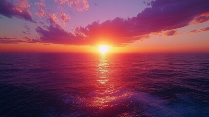 A stunning sunset over the ocean with vibrant colors. Great for themes of tranquility, nature, and relaxation.